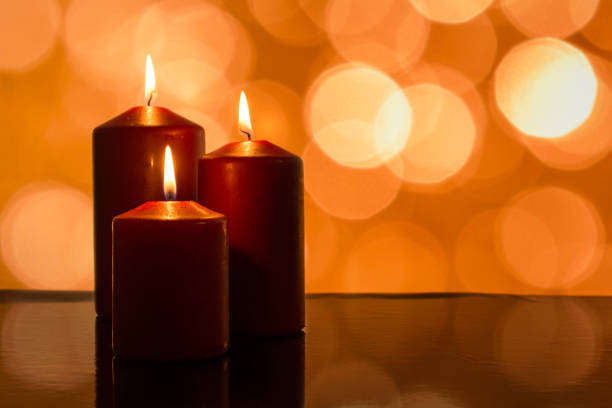 istock Christmas candles with lights and relfection 648471334