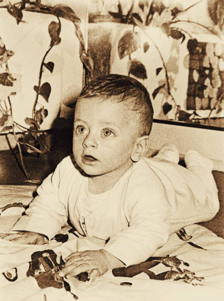 istock Grainy vintage baby photo 648471446