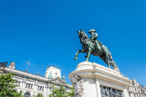 Equestrian statue of King Pedro IV statue in OPorto Liberdade square with monument of King Pedro IV statue in foreground and city hall in the top of Aliados Avenue, at Porto city, one of the most popular tourist destinations in Europe. historic heritage square phoenix stock pictures, royalty-free photos & images