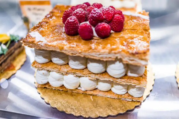 Puff pastry cake in bakery with whipped cream layers