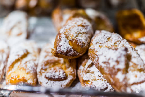 istock Small cheese danishes in powdered sugar macro closeup 648474354
