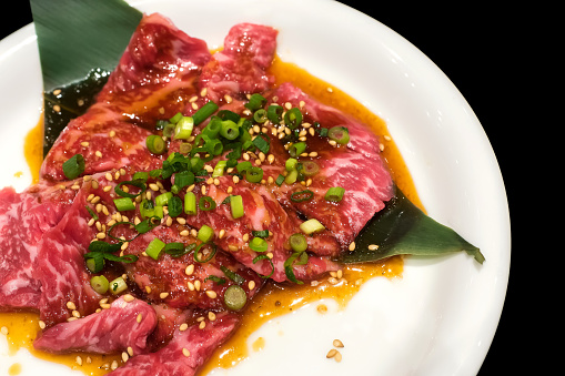 Raw japanese kobe beef sliced on plate