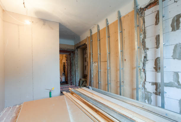 istock Interior of apartment with materials during on the renovation and construction ( making wall from gypsum plasterboard) 648478590