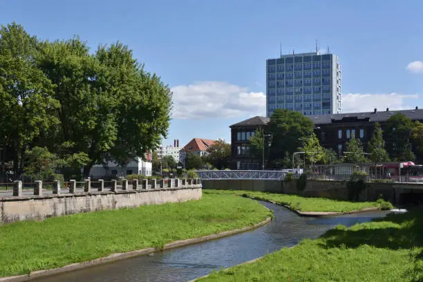 riverbed of river named Roter Main in Bayreuth with city hall in background