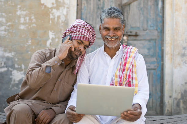 istock Father and son using laptop and mobile phone 648482138