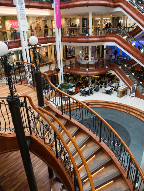 GLASGOW, SCOTLAND - 24 JAN 2017: View inside Princes Square shopping mall in Glasgow with its wooden stairs. The old building from 1840 was redesigned and now houses one of Glasgow's most famous malls