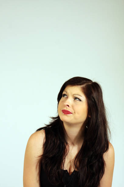 istock Young woman couriously looking up 648484728