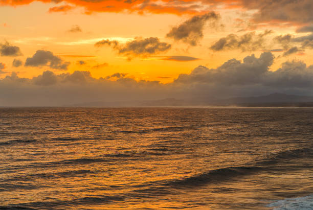 istock ocean and seascape in beautiful orange sunset 648488152