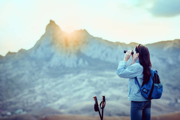 istock Young traveler with backpack standing on the big stones 648495326