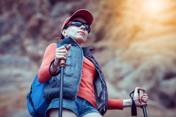 istock Young traveler with backpack standing on the big stones 648495478