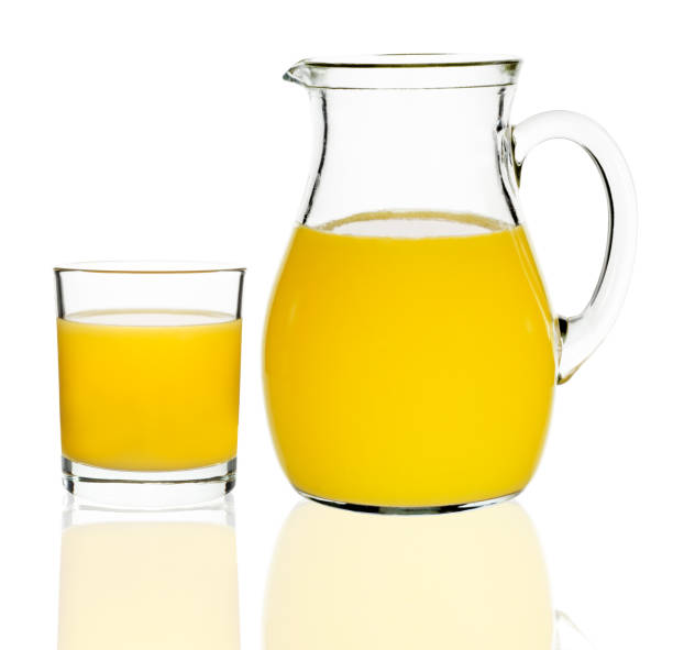 istock orange juice in a glass and carafe 648495524