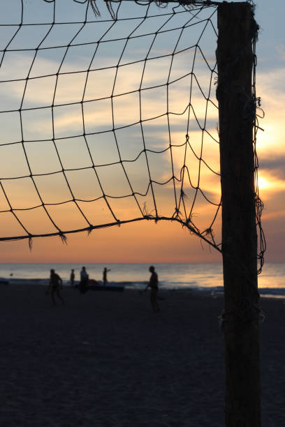 istock Old net for beach volleyball on sea coast on sunrise 648498924