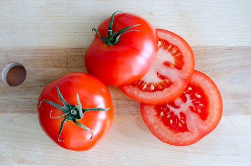 Sliced ripe tomatoes on a cutting board