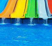 Colorful plastic water-slides in aqua park.