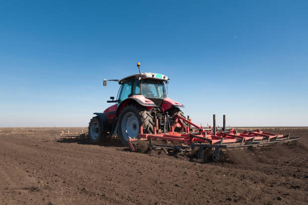 istock Farmer in tractor preparing land with seedbed cultivator 648511152