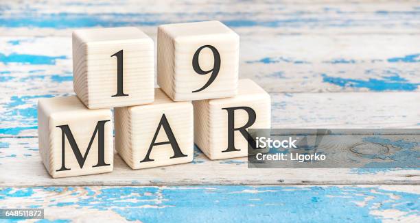 March 19th Wooden Cubes With Date Of 19 March On Old Blue Wooden Background Stock Photo - Download Image Now