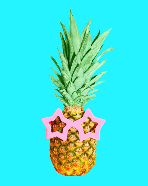 istock Pineapple with sunglasses on blue background, colorful ananas 648521124