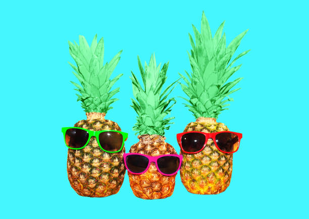 istock Three pineapple with sunglasses on blue background, colorful ananas photo 648521148