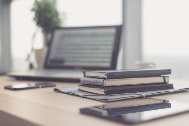 istock Documents on office table with pen and digital tablet as work space business concept. 648526360