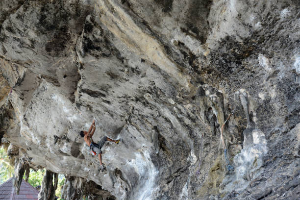 THAILAND Clinbing at the rocks of the Hat Tom Sai Beach at Railay near Ao Nang outside of the City of Krabi on the Andaman Sea in the south of Thailand. ao ton sai stock pictures, royalty-free photos & images