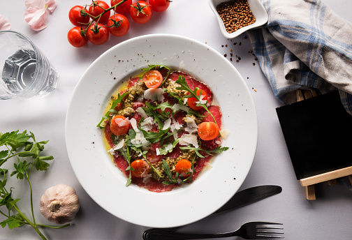 Beef carpaccio with parmesan, capers and rucola