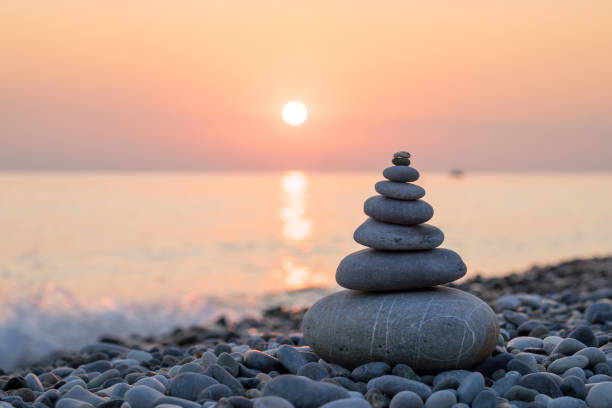 istock Pyramid of stones on sea coast 648540756