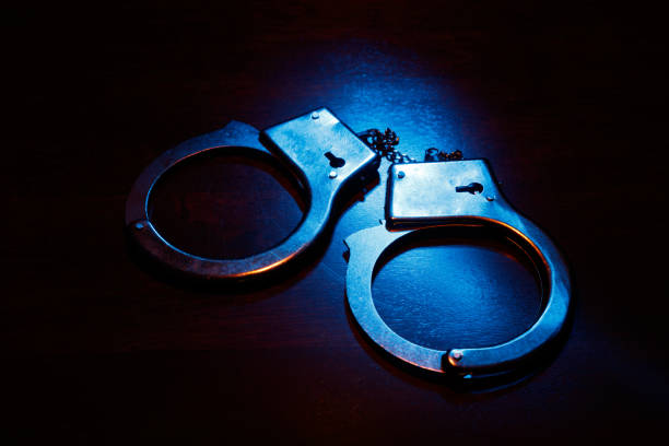 istock Pair of metal handcuffs 648543204