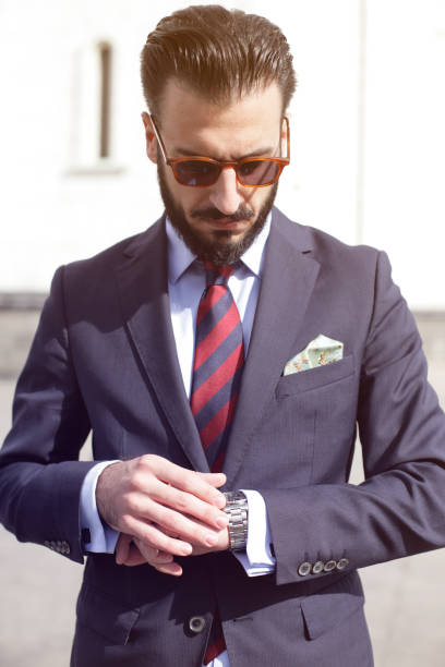 istock Young business man on the phone in public park 648553764