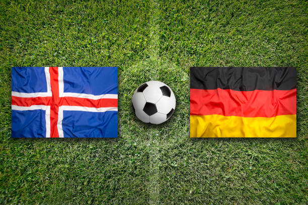 istock Iceland vs. Germany flags on soccer field 648558788
