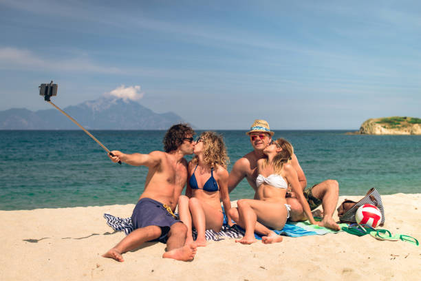 istock Group of young people on beach in summer 648576528