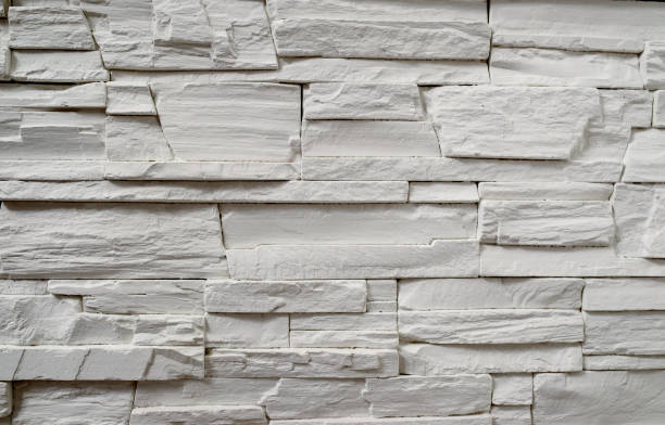 istock A fragment of a decorative wall made of artificial stone. 648579124