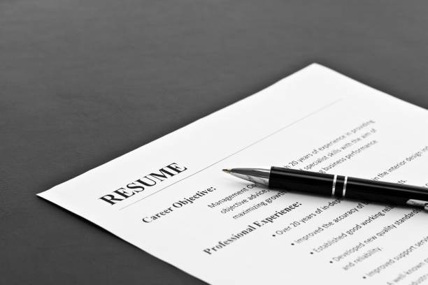 Resume on the Table Closeup of Resume with Pen on the Table good cv stock pictures, royalty-free photos & images