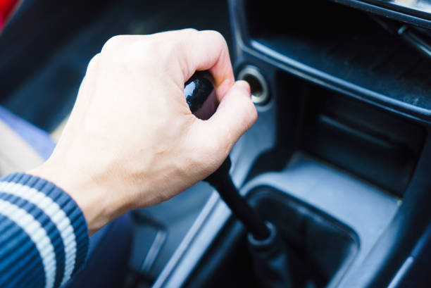 istock hand with manual gear shift lever close up 648581738