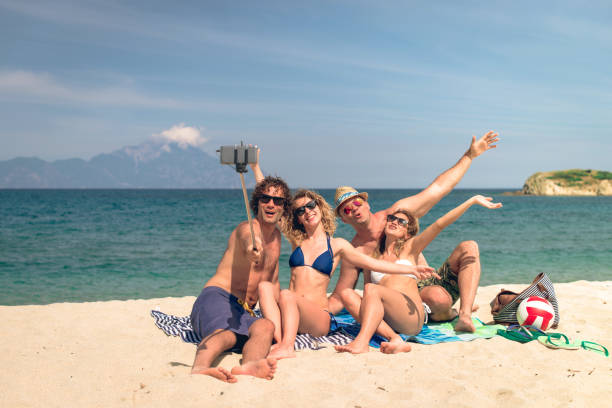 istock Group of young people on beach in summer 648581904