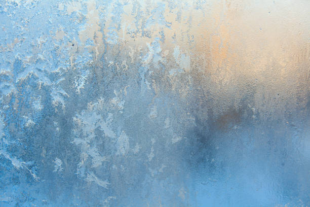 istock beautiful winter texture patterns of frost on window 648581910
