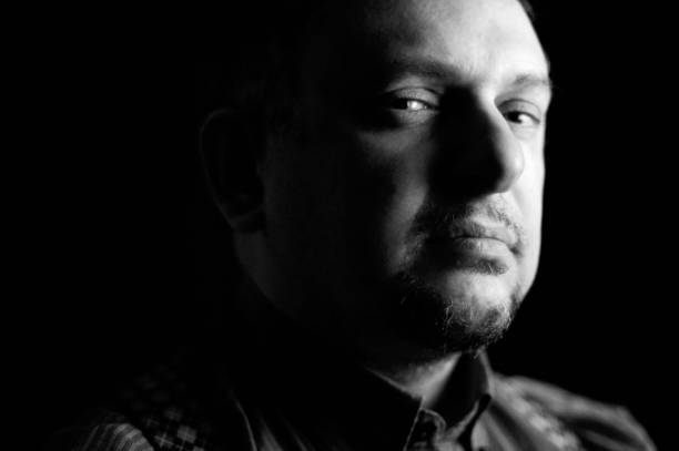 istock Just like a mafia boss - chiaroscuro portrait with evil look 648582674