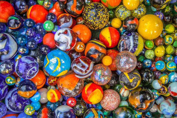 istock colorful glass marble multicultural community concept 648585236