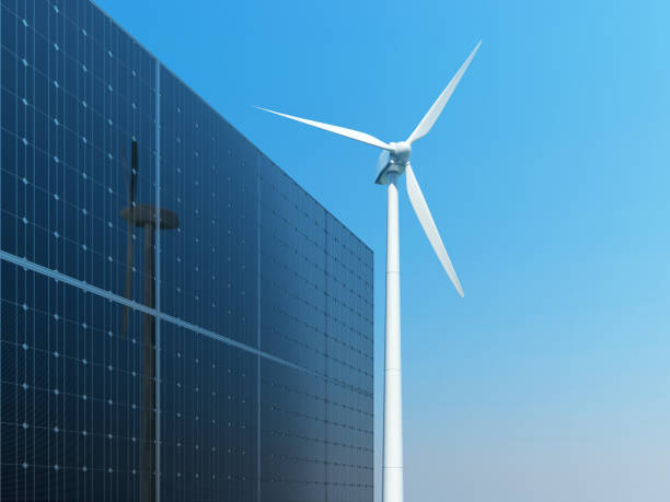 istock Solar panels and wind turbine against clear blue sky. 648594950