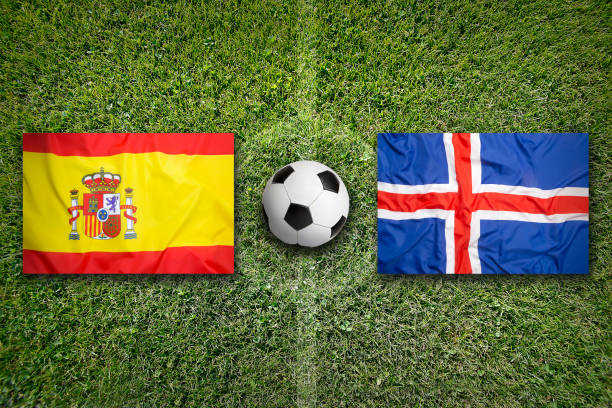 istock Spain vs. Iceland flags on soccer field 648595780