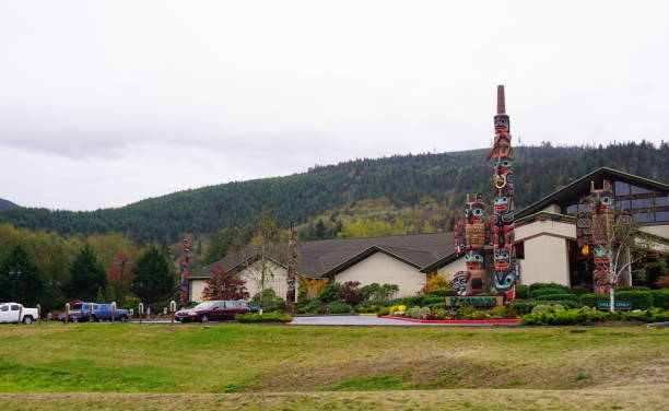 America indian totems poles Many totem pols are decorating the business building in WA. pacific northwest totem poles stock pictures, royalty-free photos & images