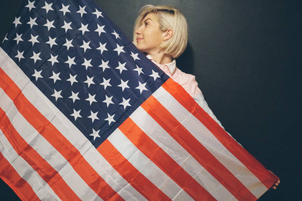 istock Blonde girl with USA flag 648608916