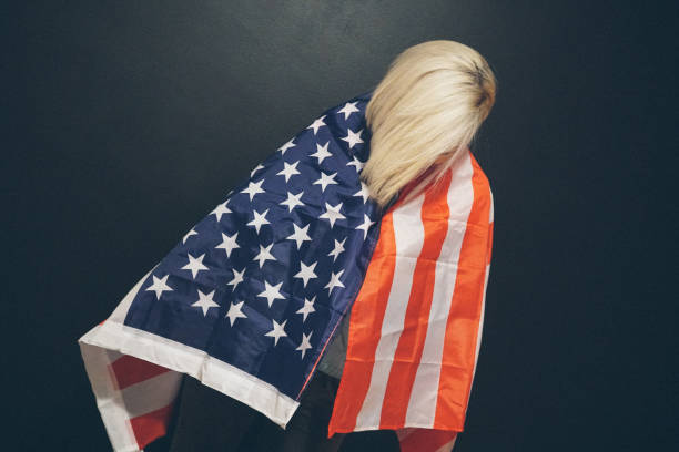 istock Blonde girl with USA flag 648608920