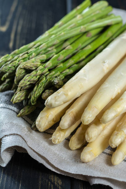 istock Spring season - fresh white and green uncooked asparagus 648609162
