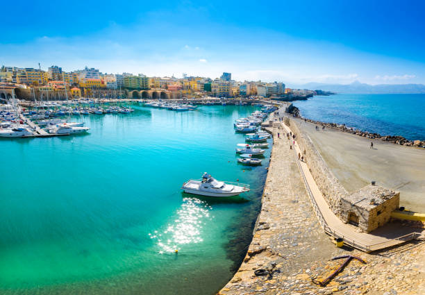 Heraklion port with old venetian fort Koule and venetian shipyards. Heraklion port with old venetian fort Koule and venetian shipyards, Crete, Greece herakleion photos stock pictures, royalty-free photos & images