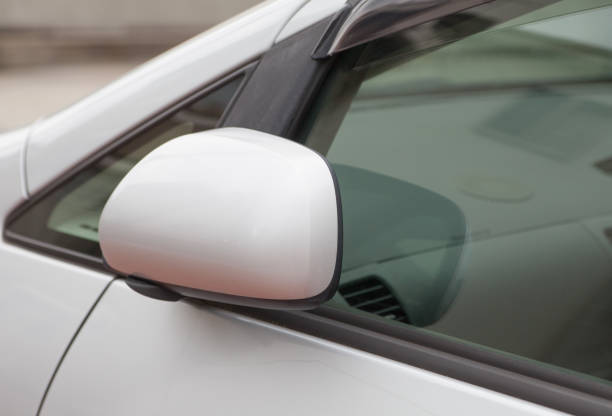 istock Side rear-view mirror closed for safety at car park. 648627748