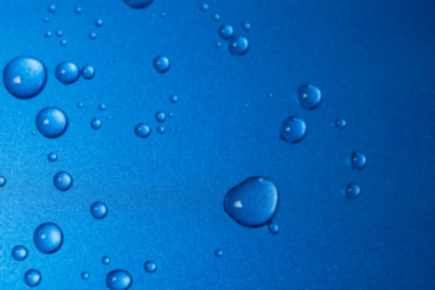 istock Abstract blur closeup water drops on blue background 648634040