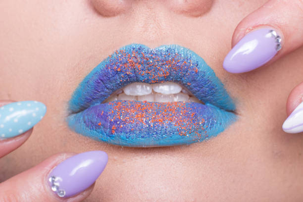 istock mouth open closeup, hand manicure nails 648639532