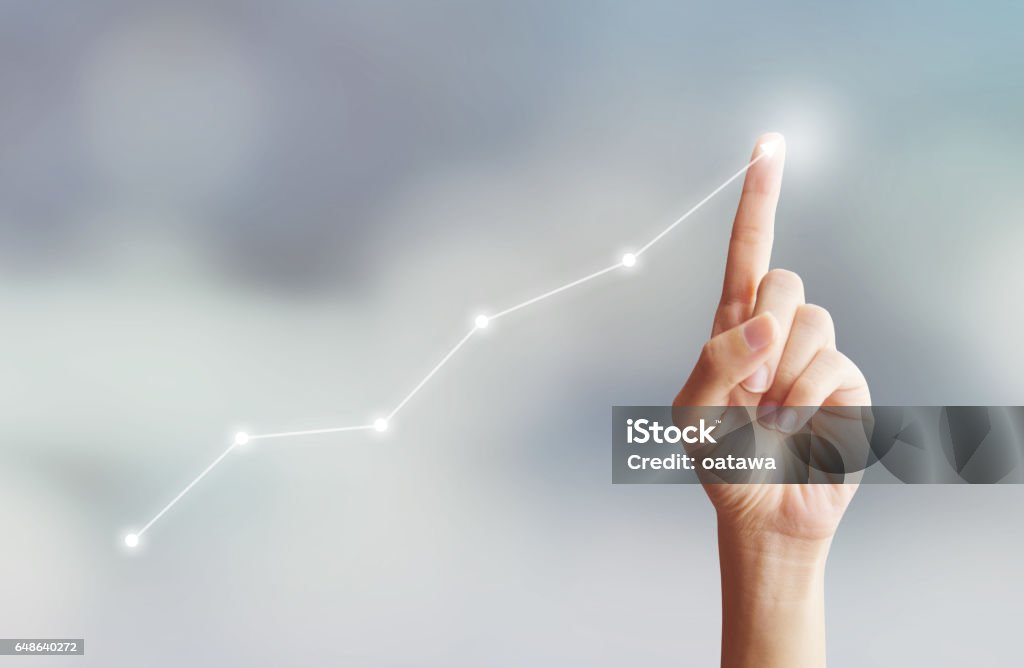 Hand touching graph moving up with plan growing Growth Stock Photo