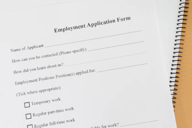 istock Close - up Blank employment application paper form 648640442