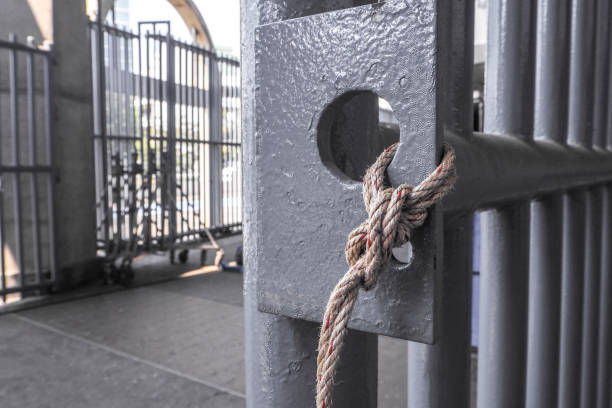 istock Ropes tied  grille door 648646434